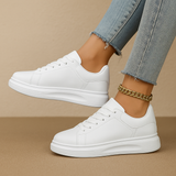 Biale skórzane sneakersy o minimalistycznym designie dla kobiet | Jinte